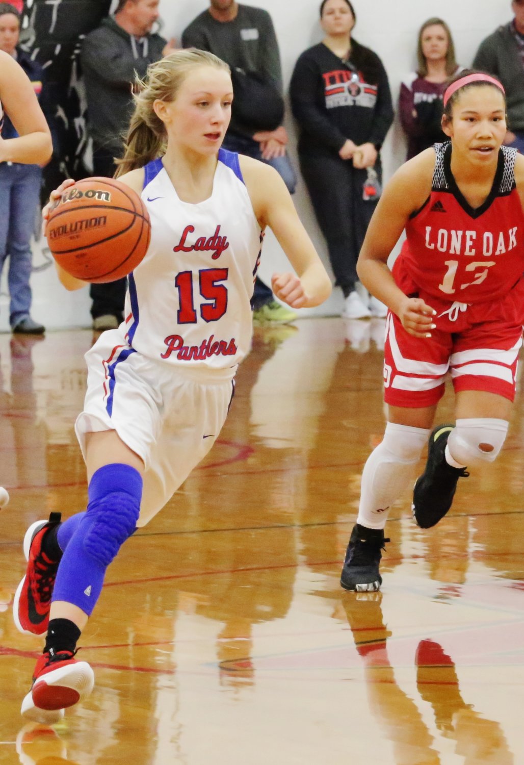 Lady Panther Bella Crawford drives toward a seam in the Lone Oak defense.